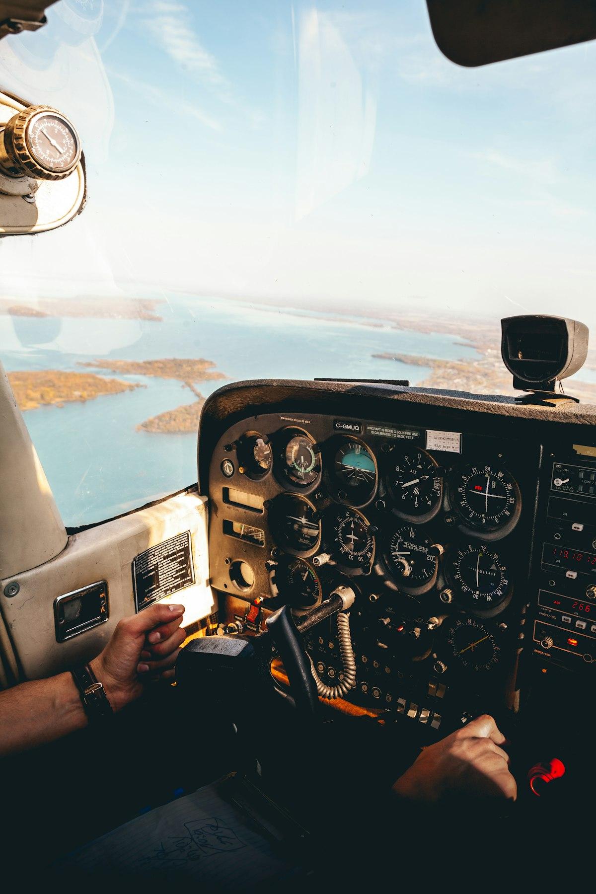 Pilot’s hands on the yoke of a small aircraft